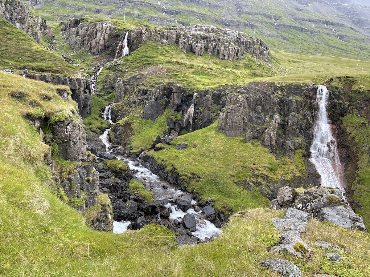 Multiple Waterfalls on the Hiking Chasing Waterfall Hike near Seydisfjordur, a must see stop when cruising Iceland.