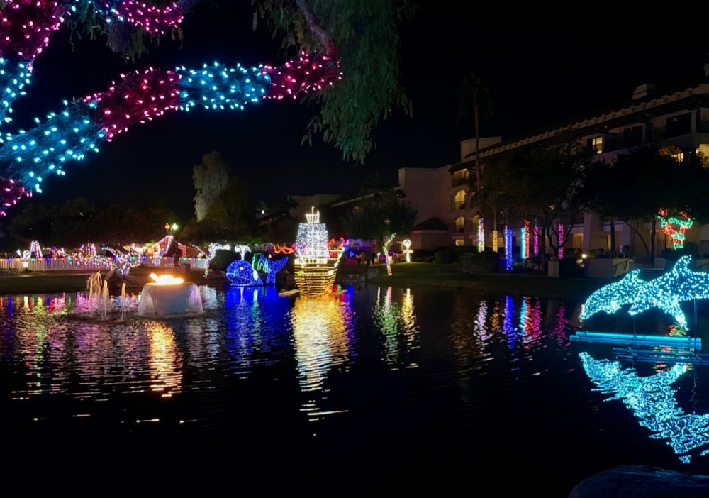 Lights display across pond at Fairmont Princess resort during Christmas in Phoenix.