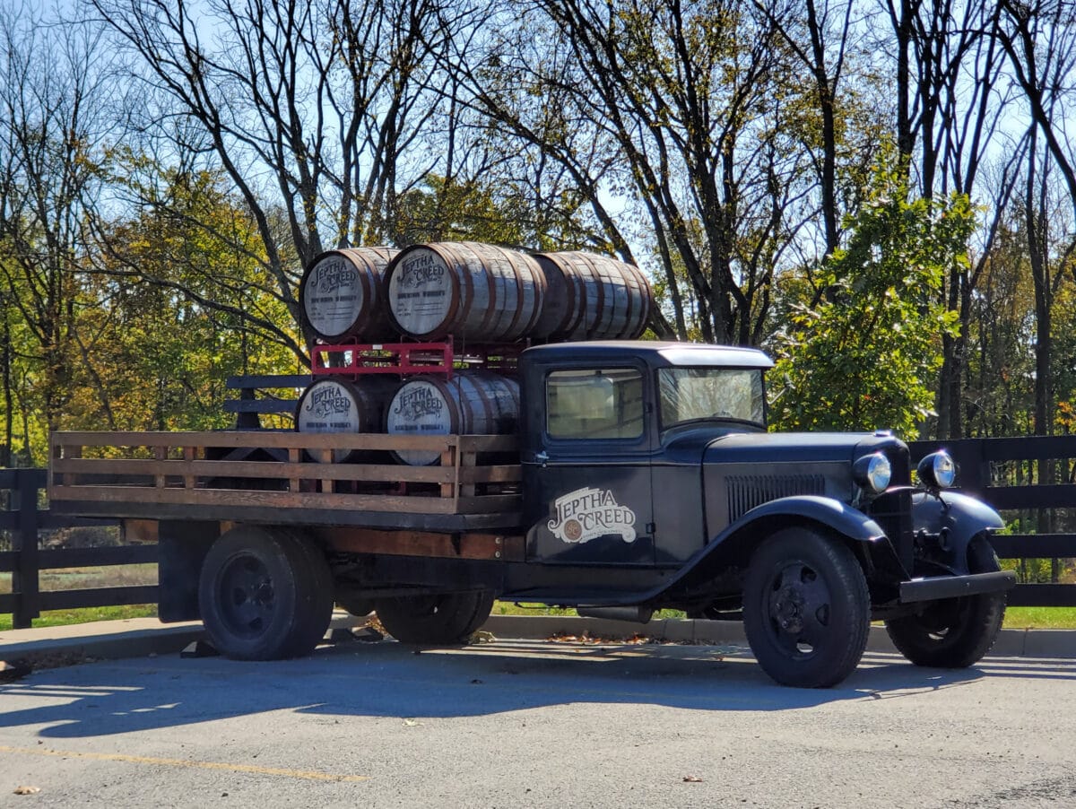 Antique truck with bourbon barrels at Jeptha Creed Distillery