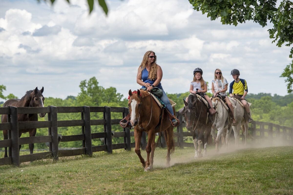 People taking a horseback ride at the Kentucky Horse Park