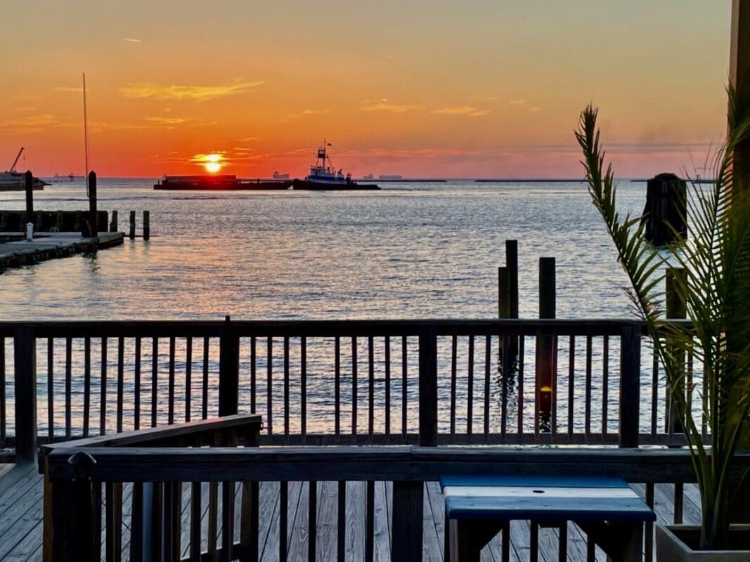 Cape Charles sunset from the Shanty restaurant. by Kurt Jacobson