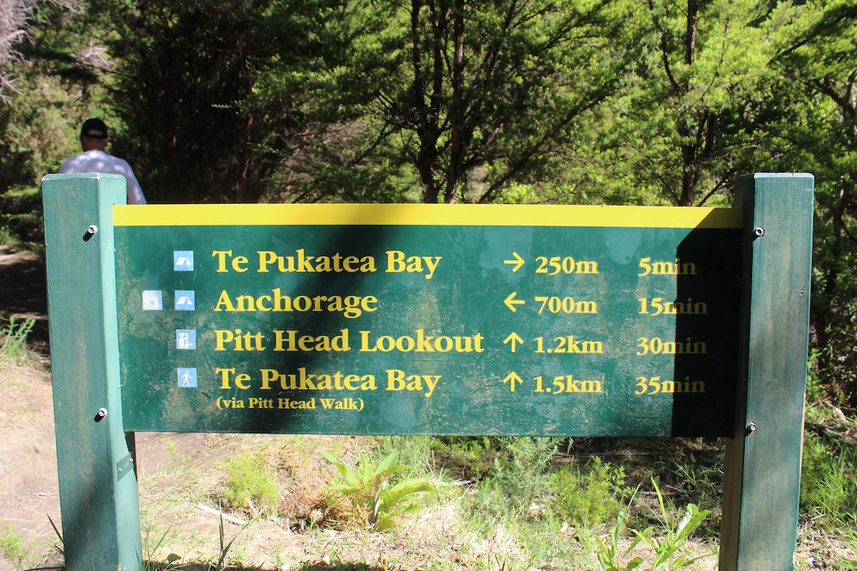 Signs like this one are often found while hiking Abel Tasman.