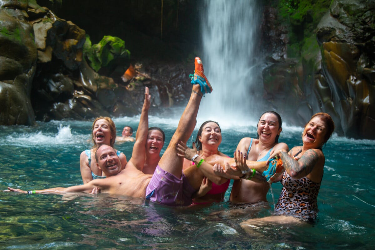 Our sober travel gang bonding in a waterfall.