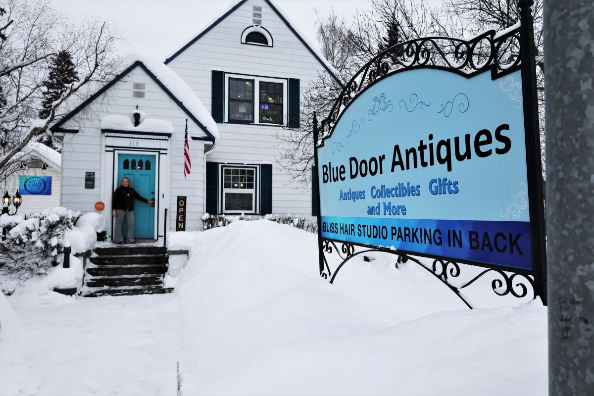 Fairbanks, Alaska. Blue Door Antiques sign and a two-story house