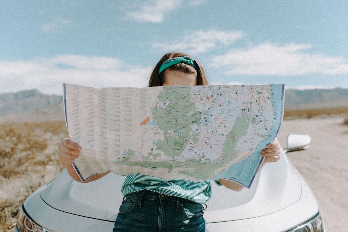 Woman traveling with a map
