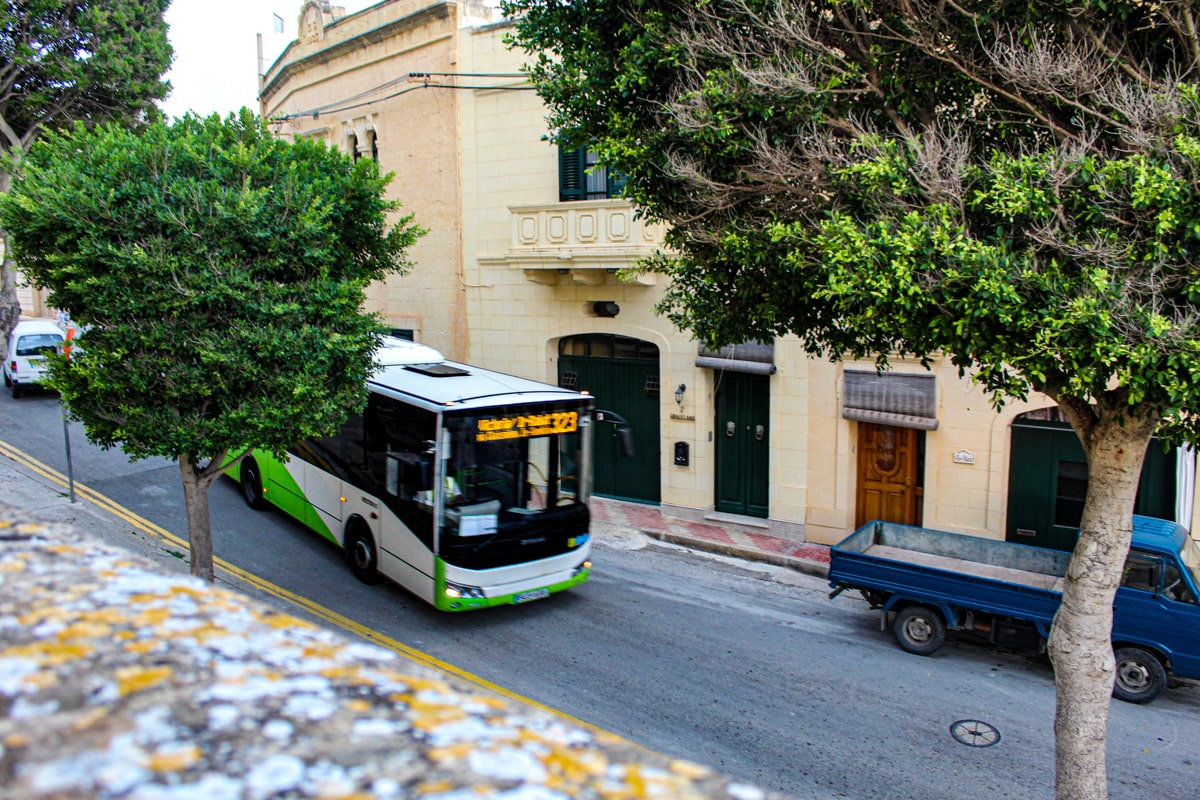 Malta Public Transport making its way through a village.