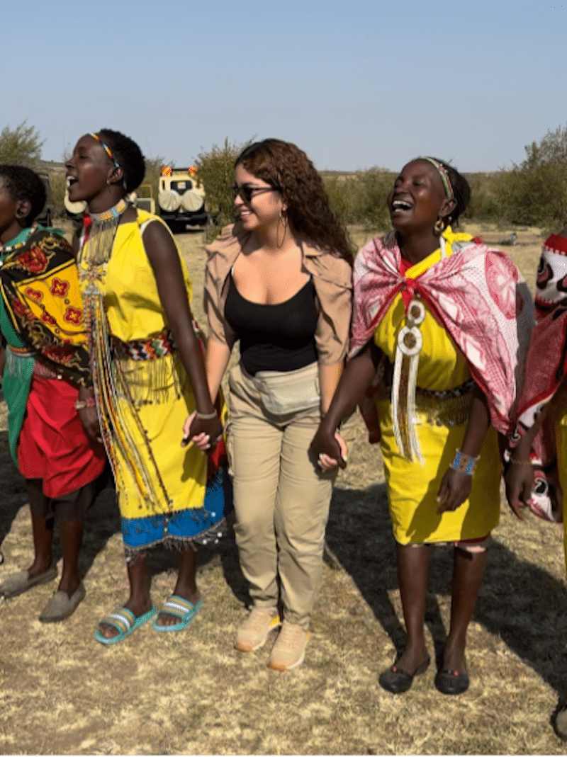 Daisy Valdes dancing with the Maasai tribe in Kenya. Photo by Daisy Valdes