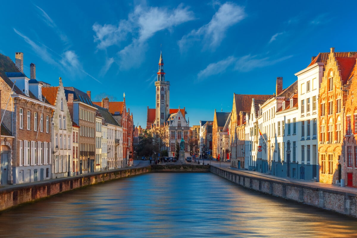 Scenic cityscape with canal Spiegelrei and Jan Van Eyck Square in the morning in Bruges, Belgium